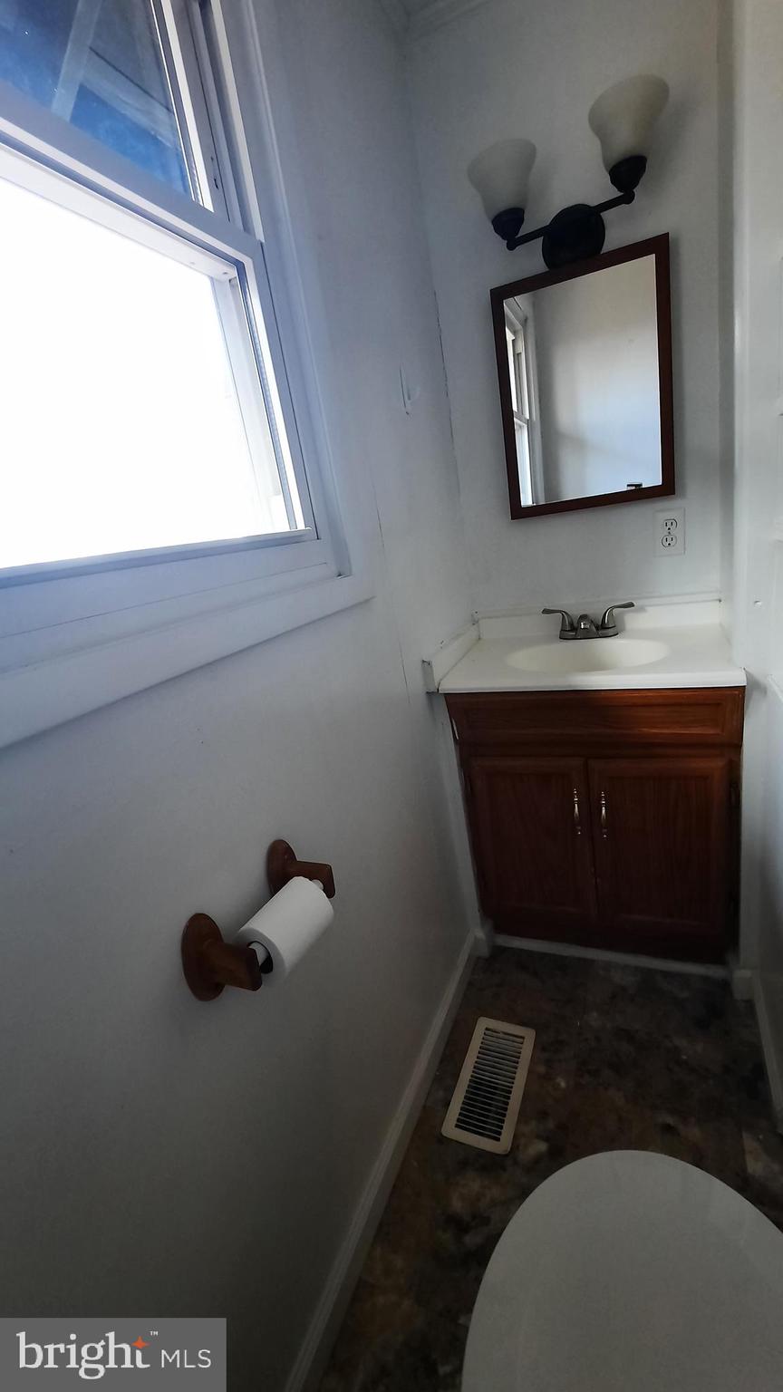 461 Chipmunk Trail Lane Linden, VA 22642 - Photo 12 of 26 a bathroom with a toilet sink and mirror