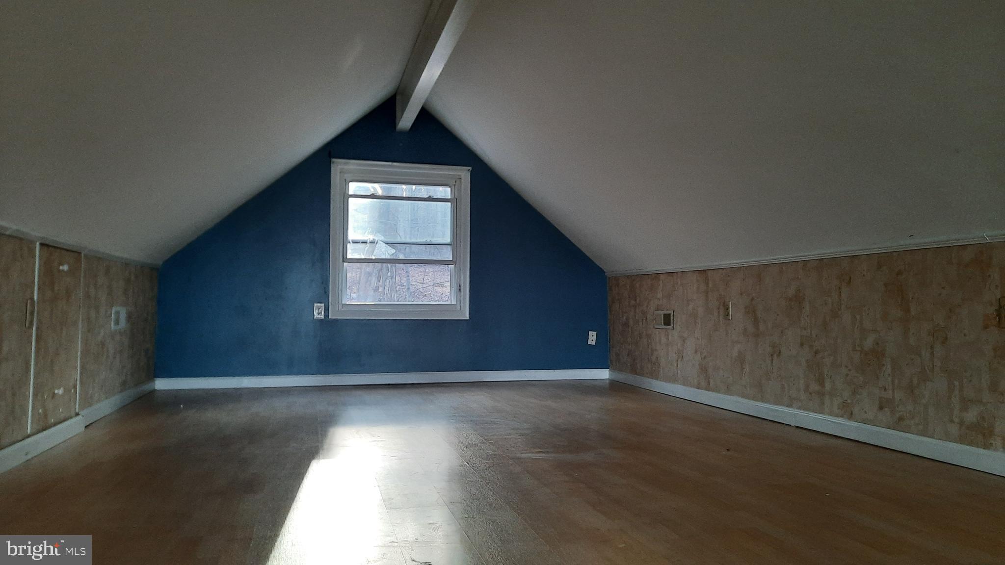 461 Chipmunk Trail Lane Linden, VA 22642 - Photo 14 of 26 an empty room with wooden floor and windows