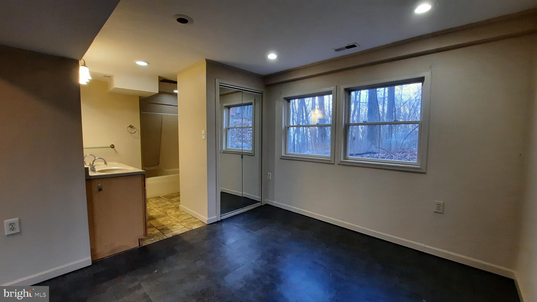 461 Chipmunk Trail Lane Linden, VA 22642 - Photo 19 of 26 a view of empty room with wooden floor and windows
