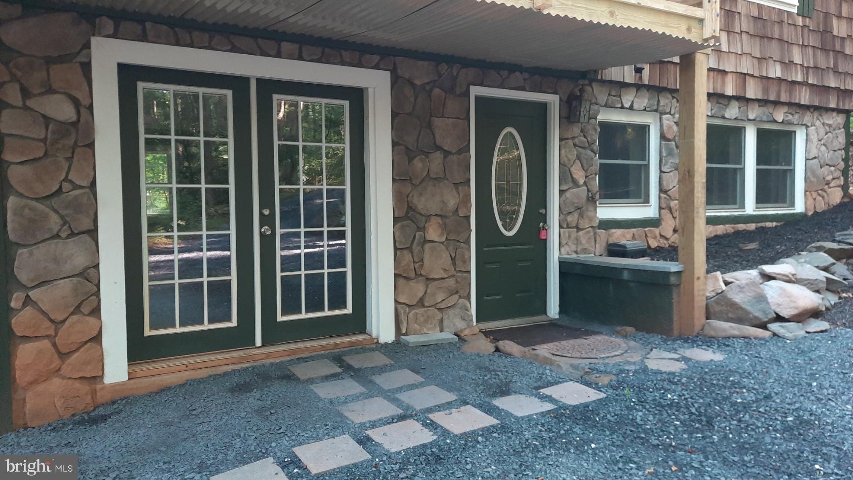 461 Chipmunk Trail Lane Linden, VA 22642 - Photo 24 of 26 a view of a brick house with a large window