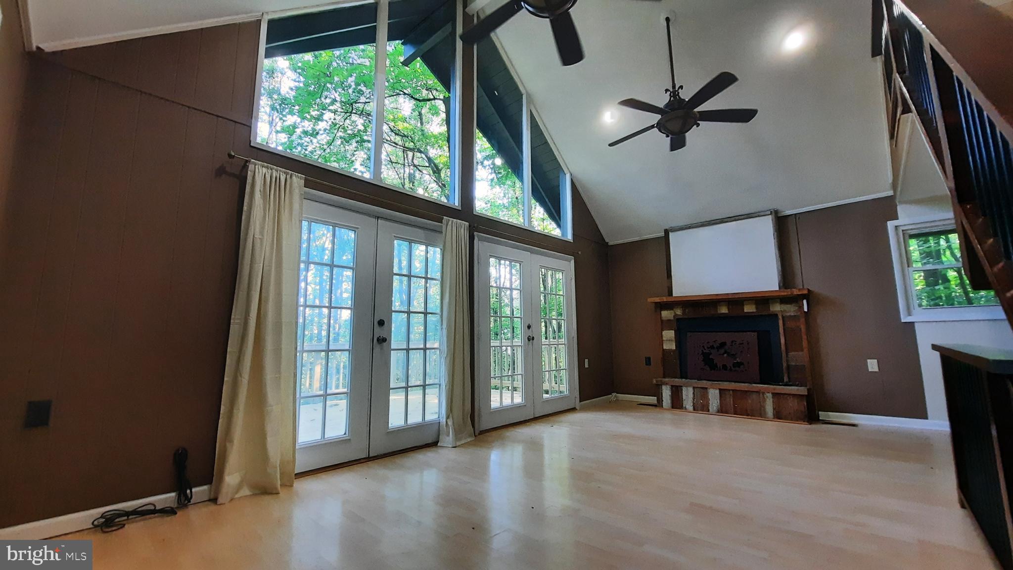 461 Chipmunk Trail Lane Linden, VA 22642 - Photo 6 of 26 a view of a livingroom with furniture and a ceiling fan