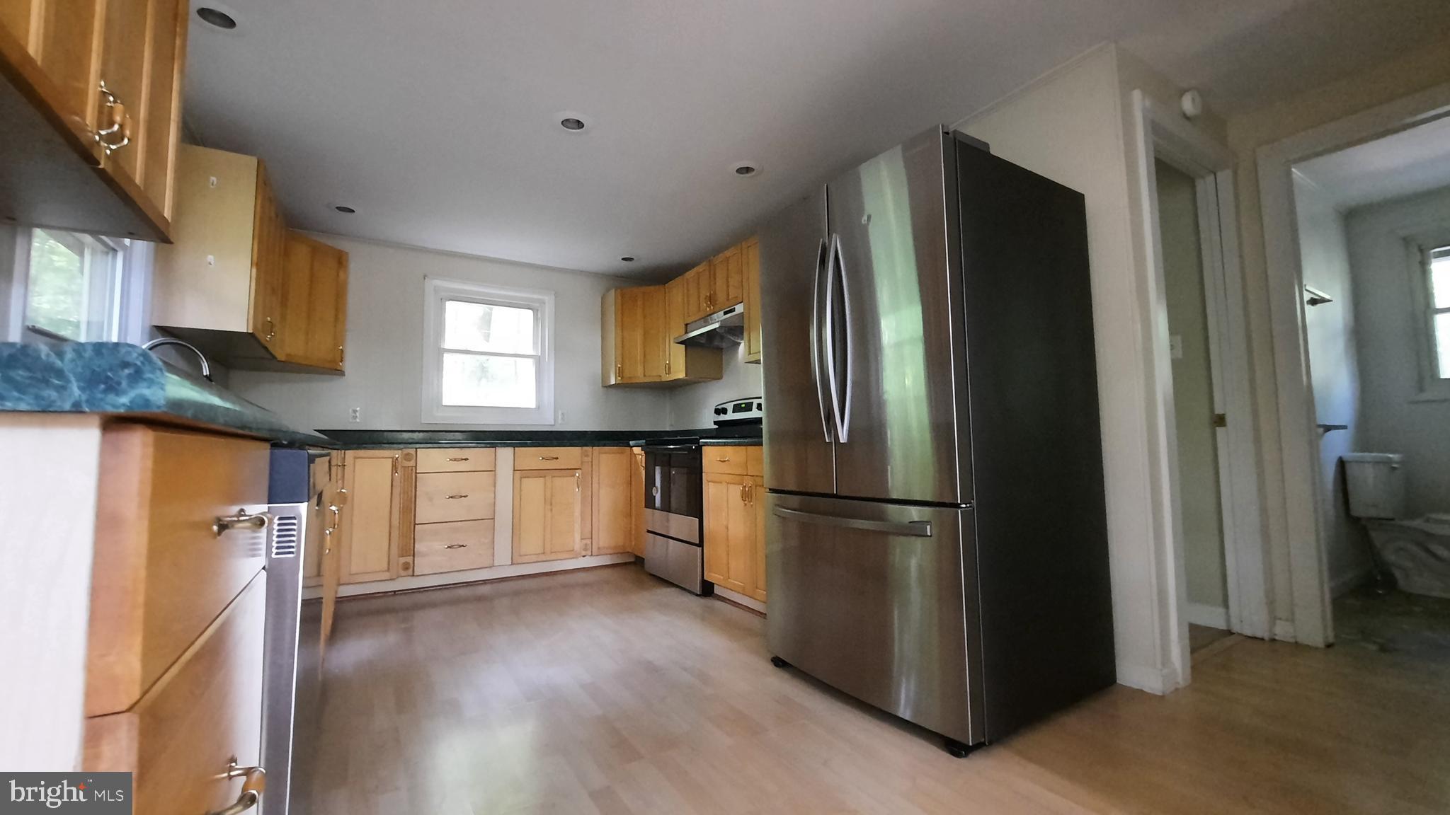 461 Chipmunk Trail Lane Linden, VA 22642 - Photo 7 of 26 a kitchen with granite countertop stainless steel appliances a refrigerator and cabinets