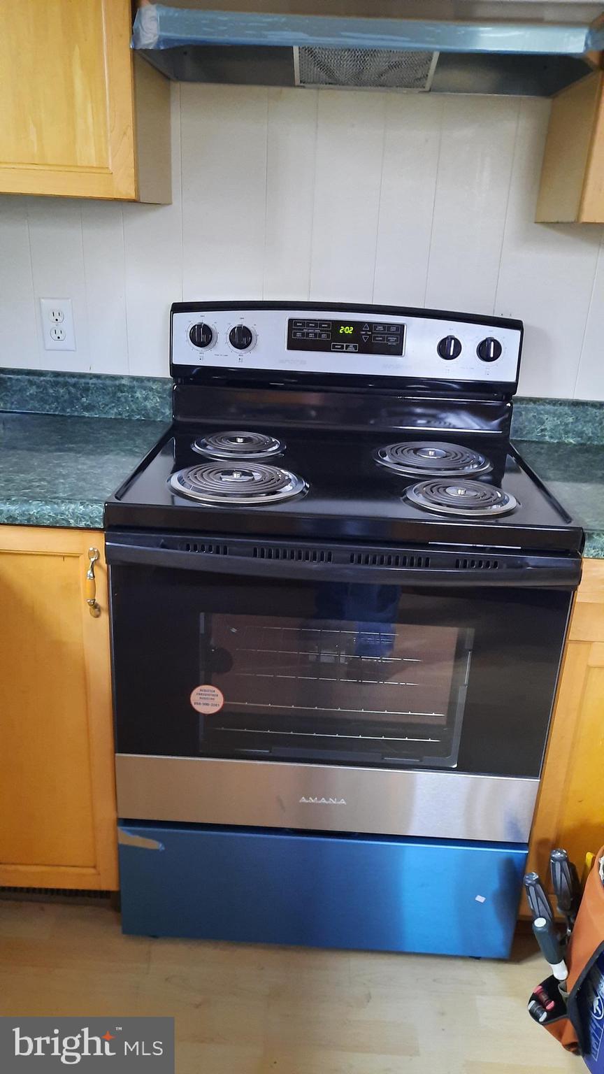 461 Chipmunk Trail Lane Linden, VA 22642 - Photo 9 of 26 a stove top oven sitting inside of a kitchen