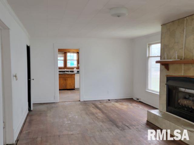 617 North 14th Street Herrin, IL 62948 - Photo 2 of 23 an empty room with windows and fireplace