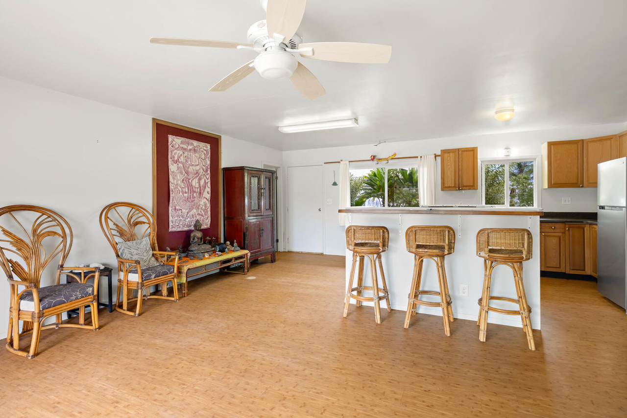 1010 Kealoha Road Kapaa, HI 96746 - Photo 9 of 30 a view of a dining room with furniture window and wooden floor