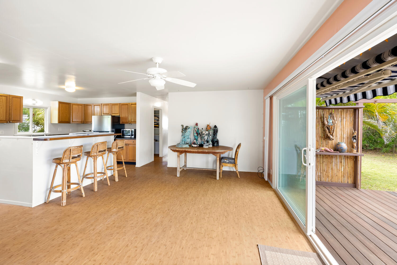 1010 Kealoha Road Kapaa, HI 96746 - Photo 10 of 30 a living room with furniture a dining table and kitchen view