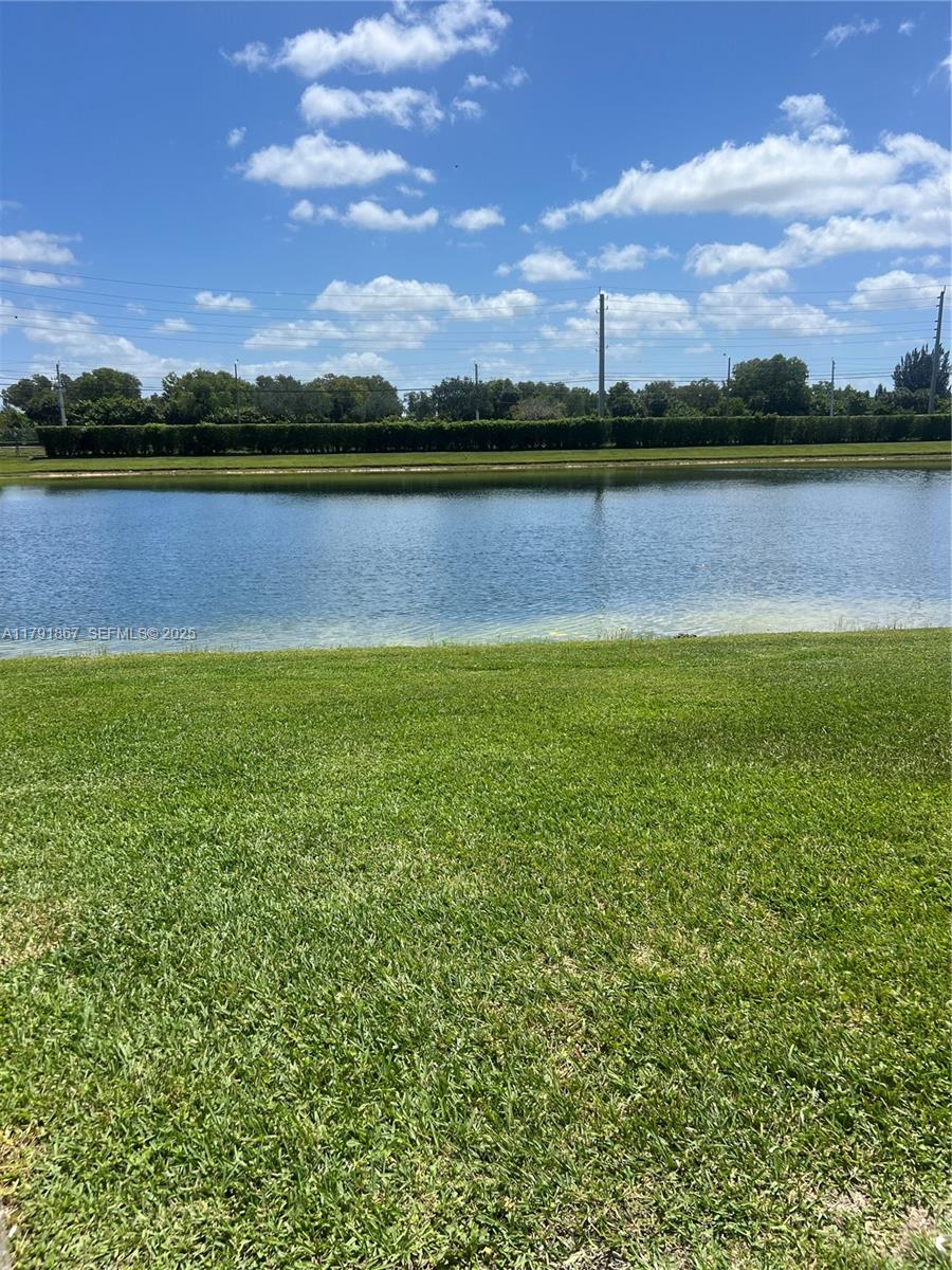 5357 Southwest 125th Avenue Miramar, FL 33027 - Photo 14 of 39 a view of a lake with houses in the background