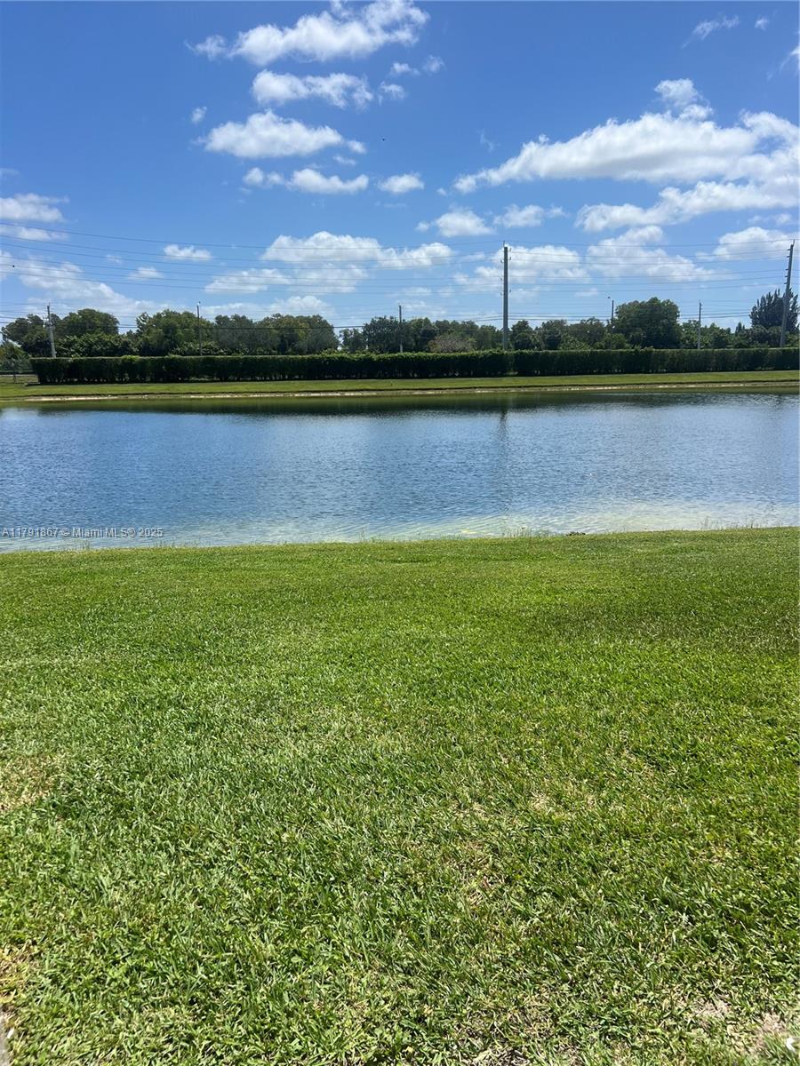 5357 Southwest 125th Avenue Miramar, FL 33027 - Photo 14 of 39 a view of a lake with houses in the background