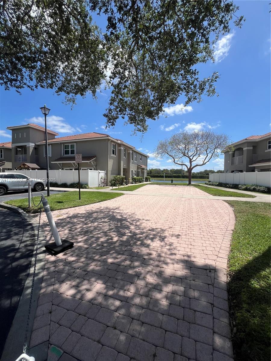 5357 Southwest 125th Avenue Miramar, FL 33027 - Photo 2 of 39 a view of a swimming pool with a patio