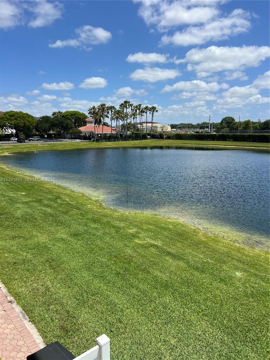 5357 Southwest 125th Avenue Miramar, FL 33027 - Photo 30 of 39 a view of a lake with houses in the back