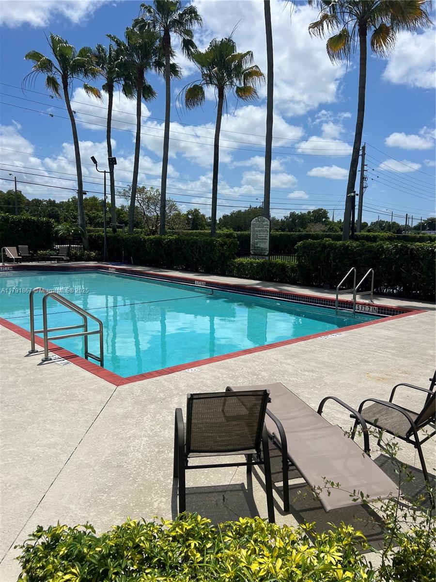 5357 Southwest 125th Avenue Miramar, FL 33027 - Photo 34 of 39 a view of swimming pool with chairs