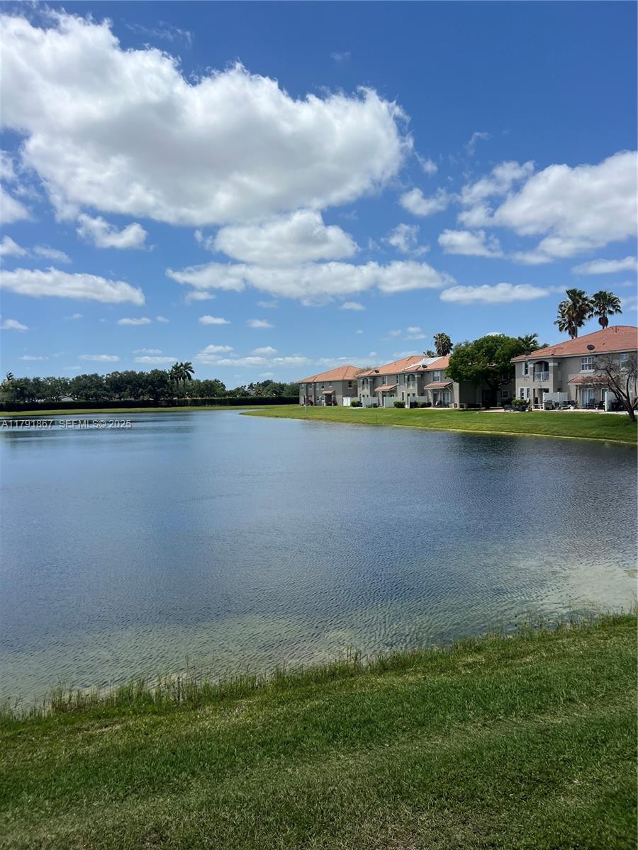 5357 Southwest 125th Avenue Miramar, FL 33027 - Photo 37 of 39 a view of a lake with houses in the back