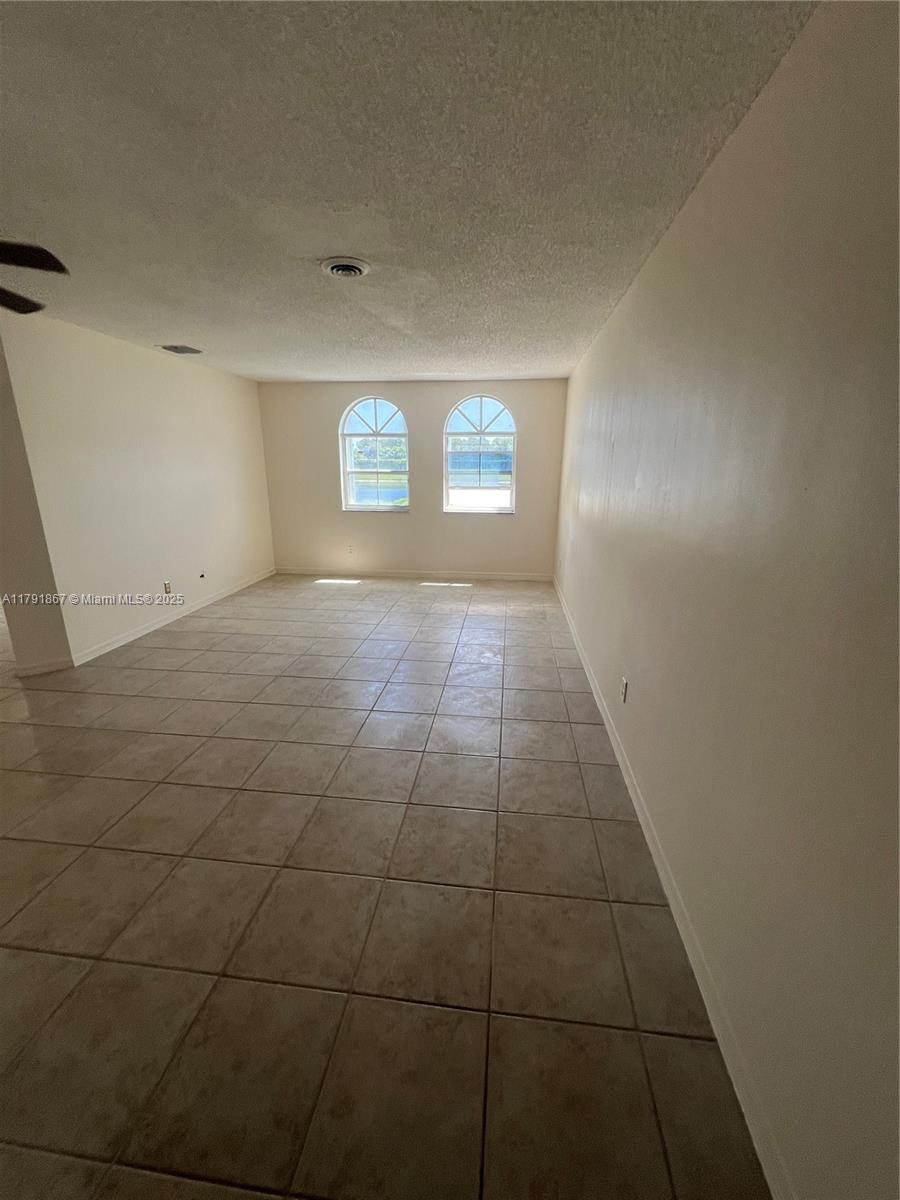 5357 Southwest 125th Avenue Miramar, FL 33027 - Photo 5 of 39 a view of an empty room and a window