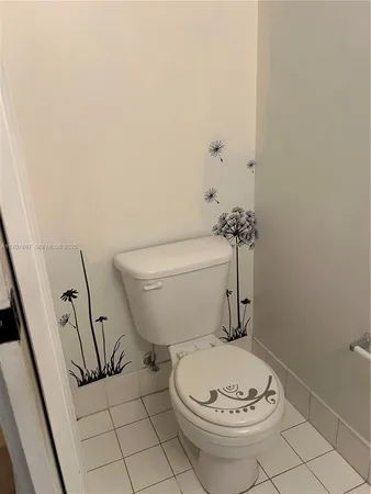 a bathroom with a toilet and a sink