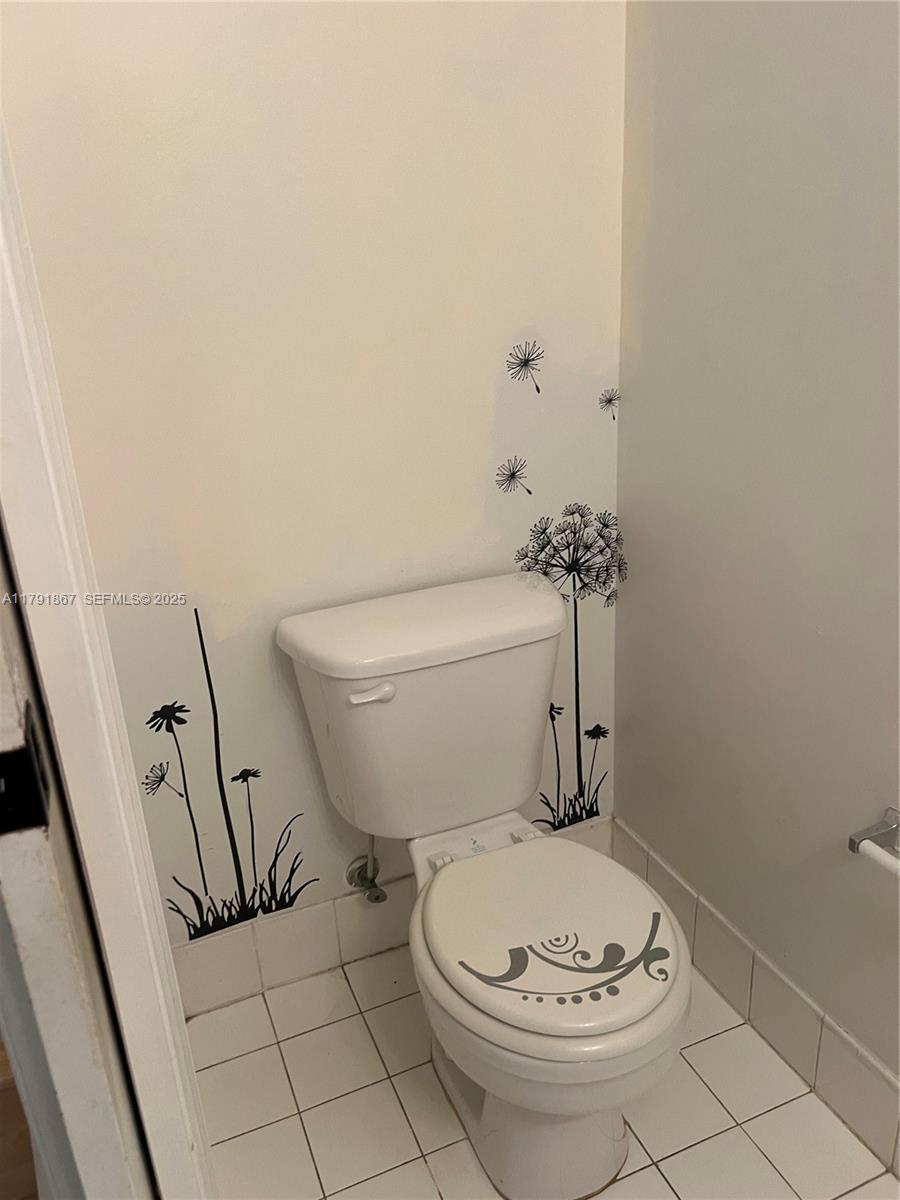 5357 Southwest 125th Avenue Miramar, FL 33027 - Photo 8 of 39 a bathroom with a toilet and a sink