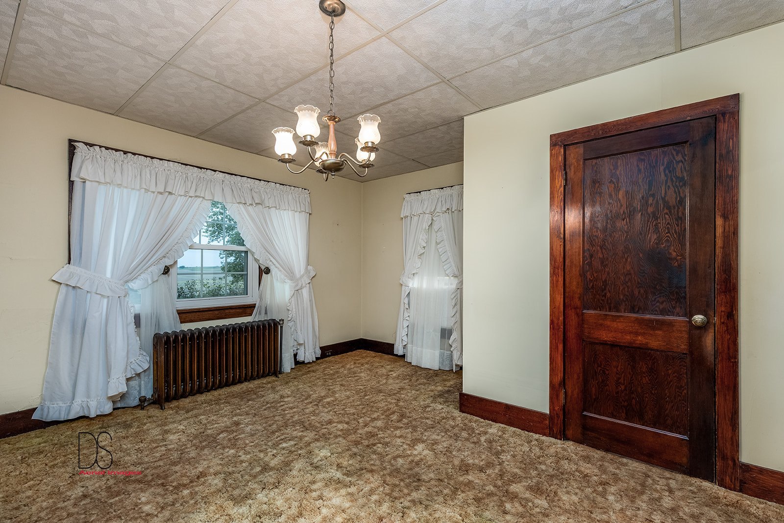 1006 North 2401st Road Ottawa, IL 61350 - Photo 8 of 35 a view of a livingroom with a chandelier curtains and wooden floor