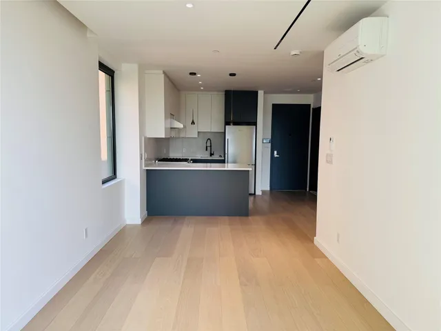 a view of a kitchen with a sink and cabinets