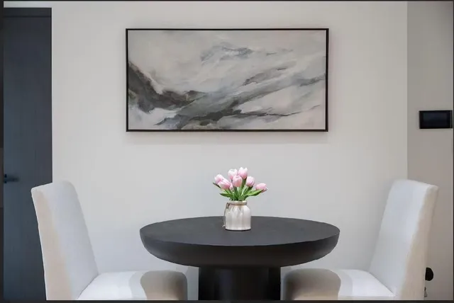 a dining room with furniture and wooden floor