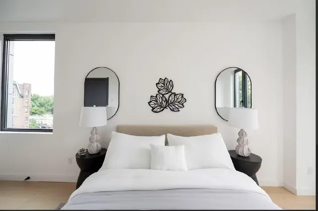 a bedroom with a bed and window