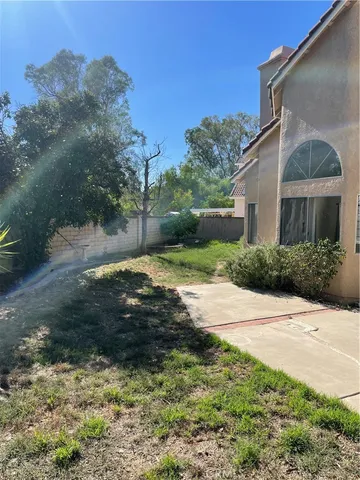 a view of a back yard of a house