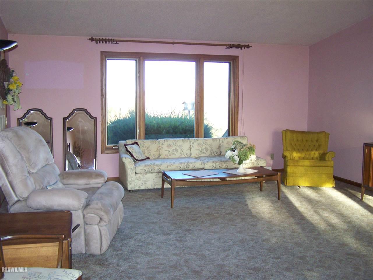 9833 Becker Road Savanna, IL 61074 - Photo 11 of 25 a living room with furniture and a table