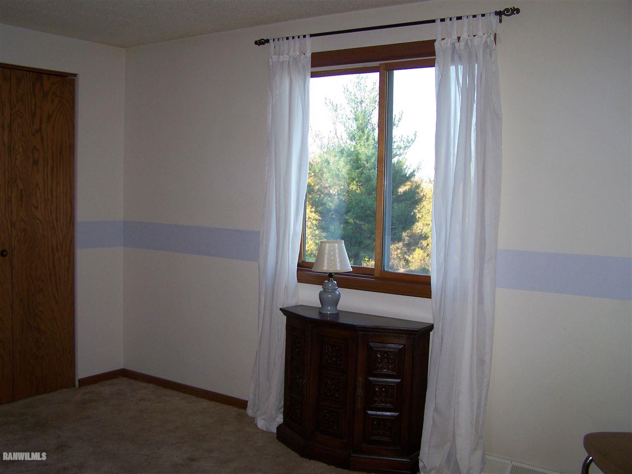 9833 Becker Road Savanna, IL 61074 - Photo 12 of 25 a room with a window