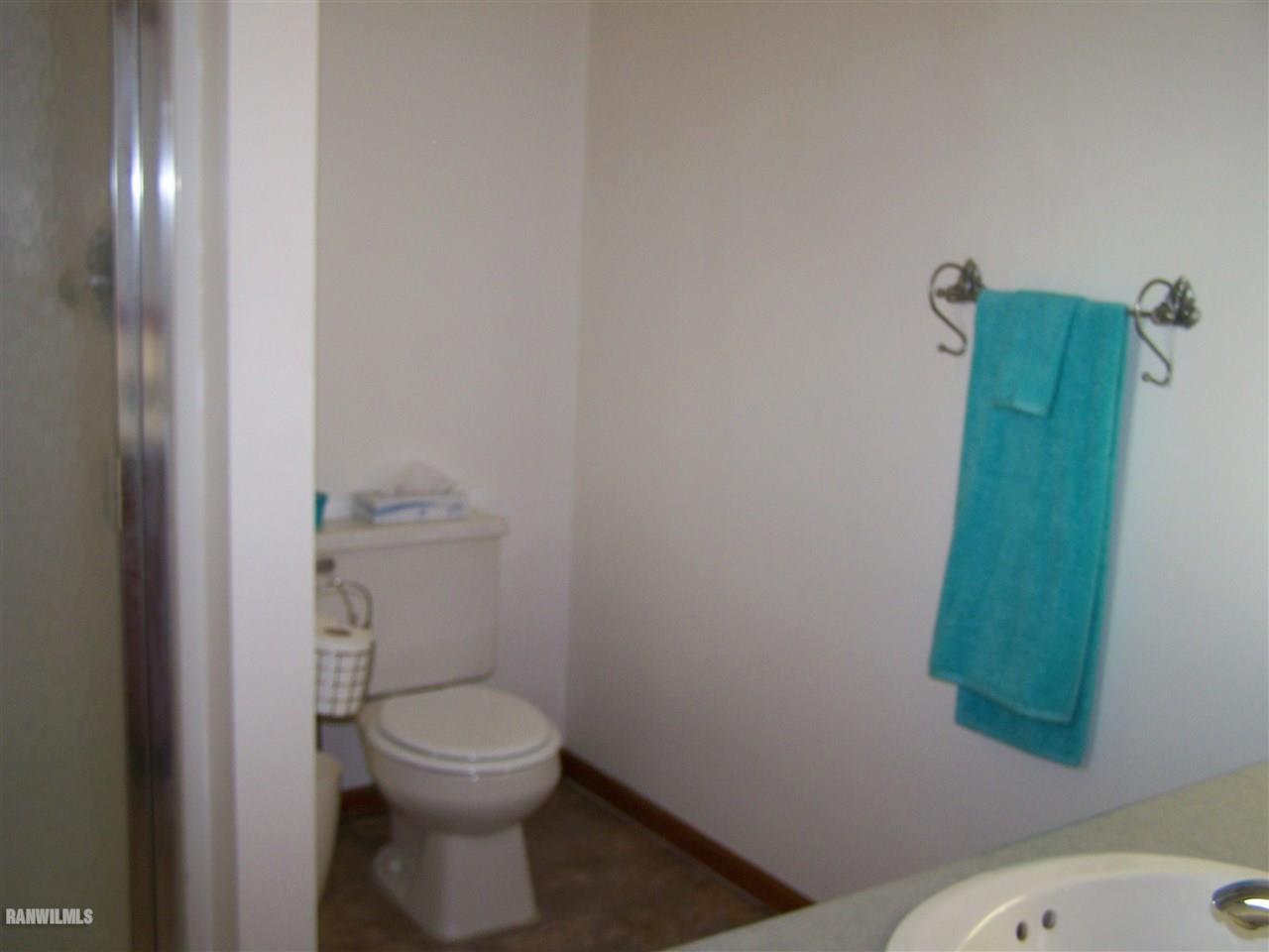 9833 Becker Road Savanna, IL 61074 - Photo 15 of 25 a bathroom with a toilet and a sink