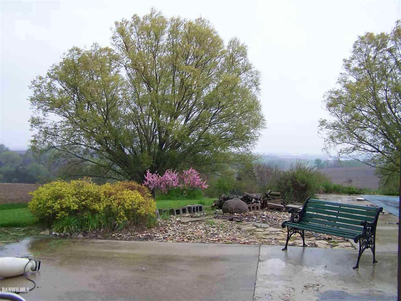 9833 Becker Road Savanna, IL 61074 - Photo 22 of 25 a view of a bench in the garden