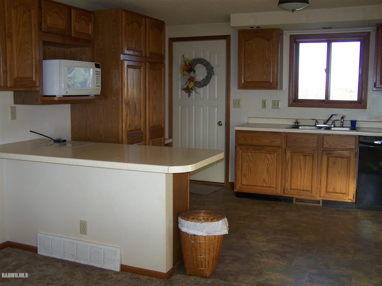 9833 Becker Road Savanna, IL 61074 - Photo 7 of 25 a bathroom with a sink and a mirror