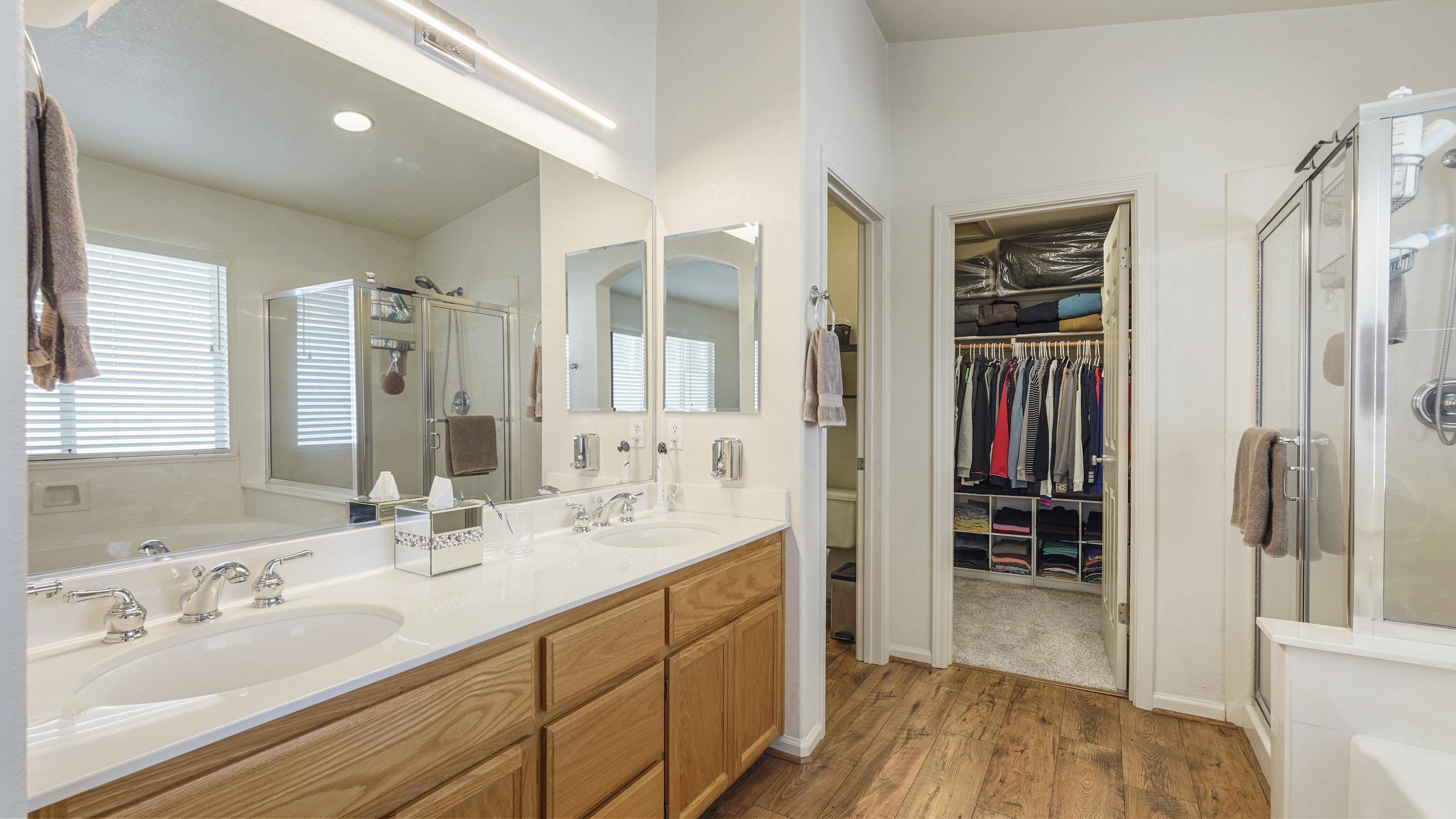 1388 Four Oaks Road San Jose, CA 95131 - Photo 24 of 47 a spacious bathroom with a shower sink and a mirror