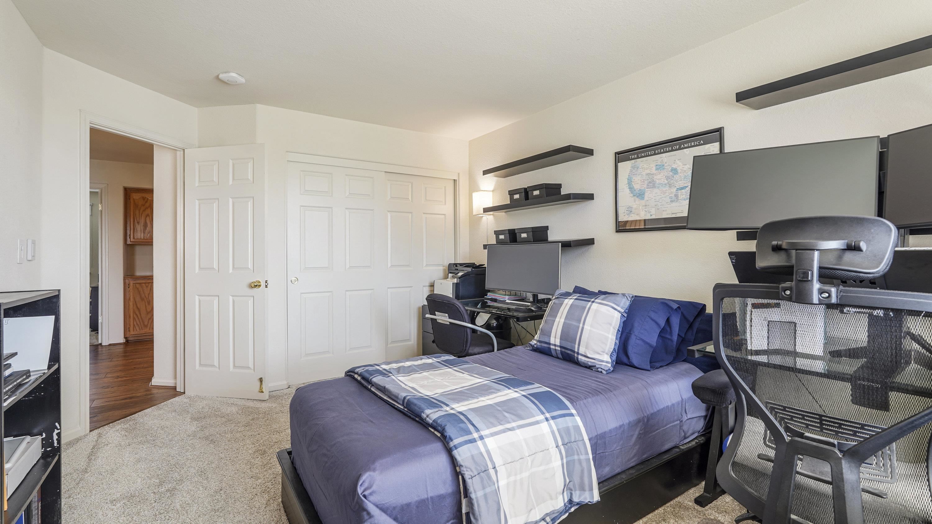 1388 Four Oaks Road San Jose, CA 95131 - Photo 28 of 47 a bedroom with a bed and wooden floor