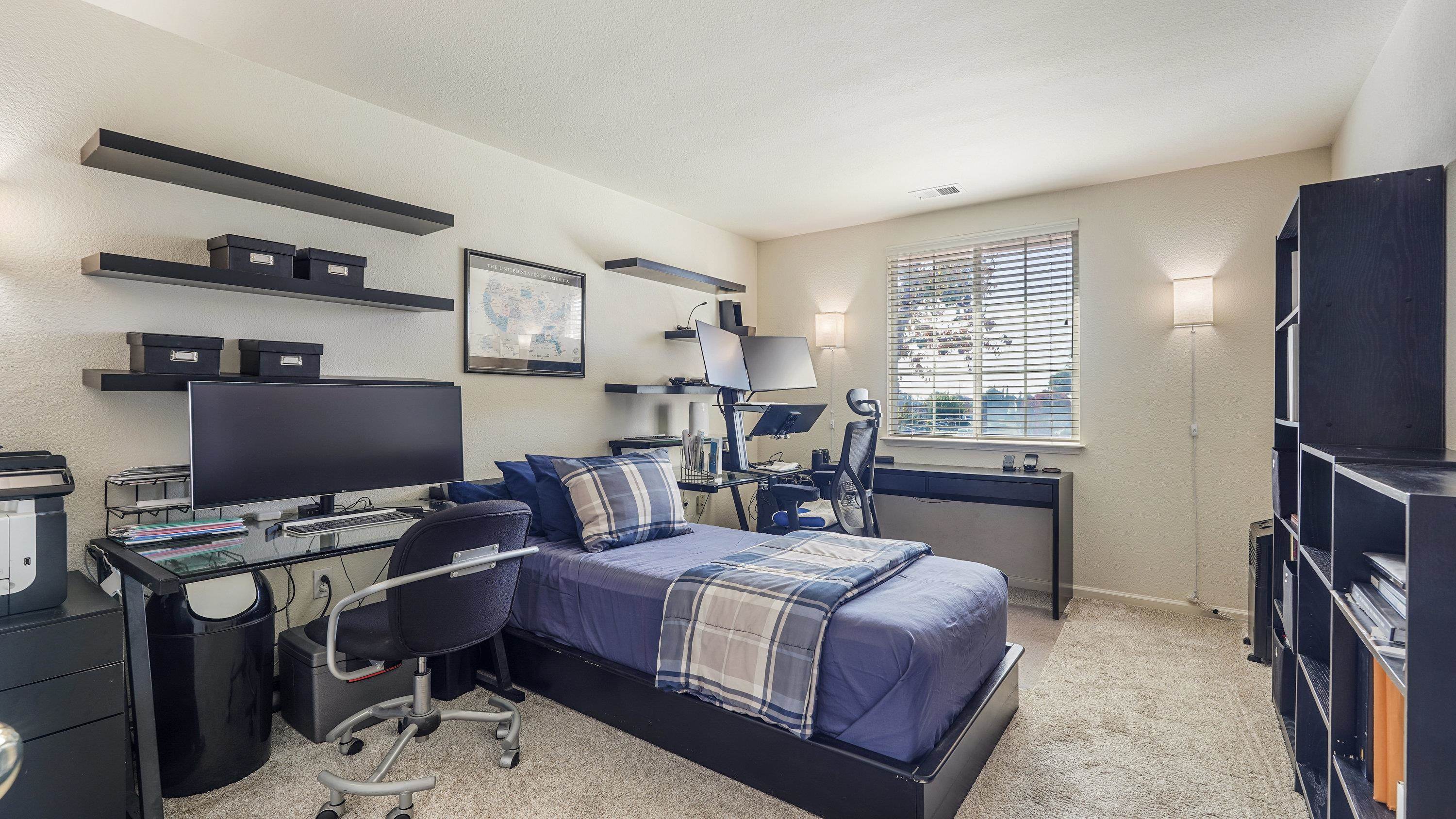 1388 Four Oaks Road San Jose, CA 95131 - Photo 30 of 47 a bedroom with a bed and a bookshelf