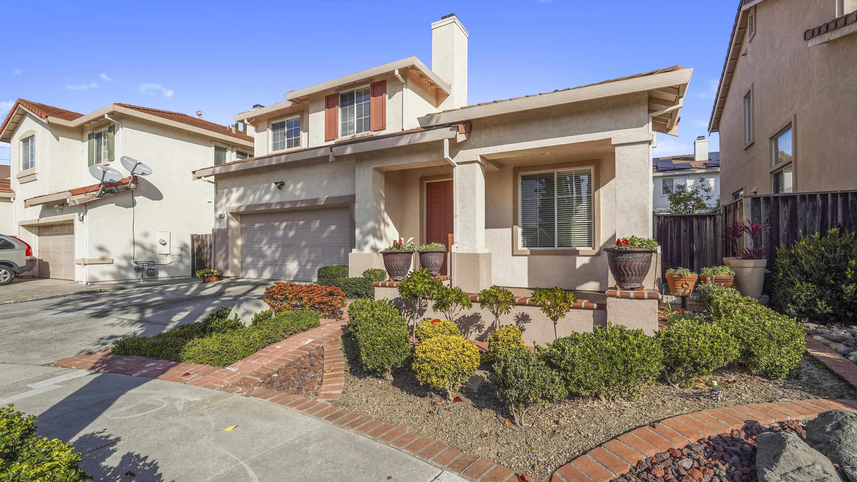 1388 Four Oaks Road San Jose, CA 95131 - Photo 3 of 47 a front view of a house with garden