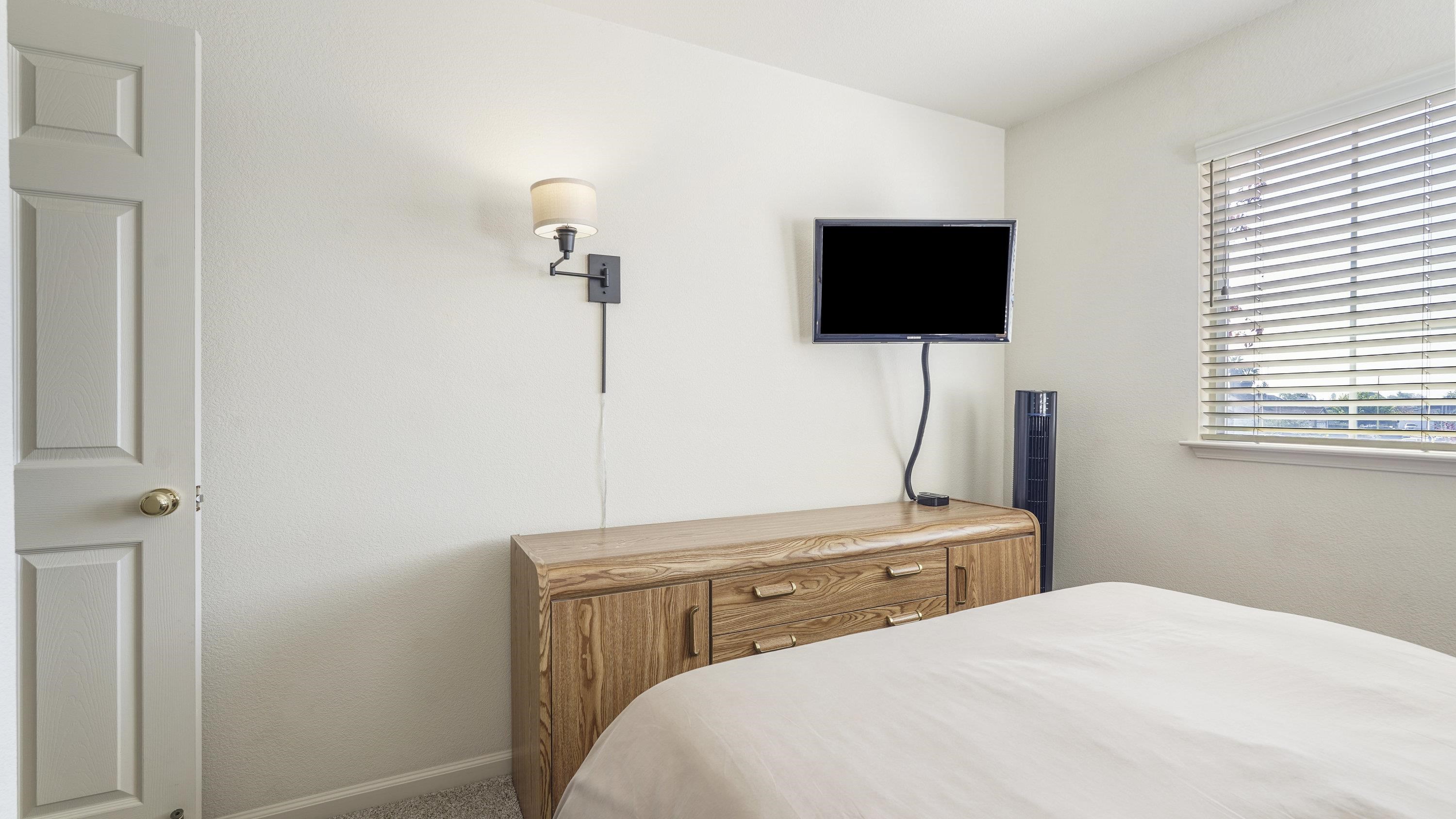 1388 Four Oaks Road San Jose, CA 95131 - Photo 31 of 47 a bedroom with a bed and a flat screen tv