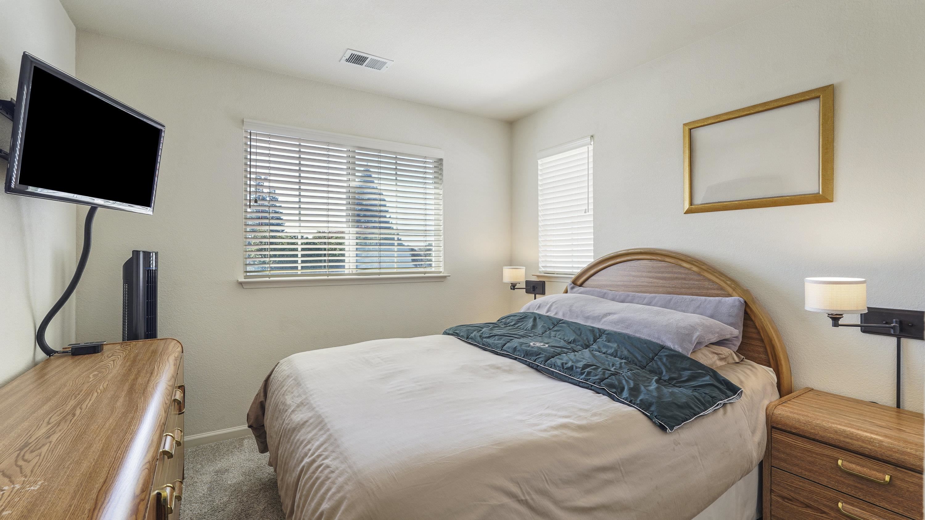 1388 Four Oaks Road San Jose, CA 95131 - Photo 33 of 47 a bedroom with a bed a couch and a flat tv screen on a dresser