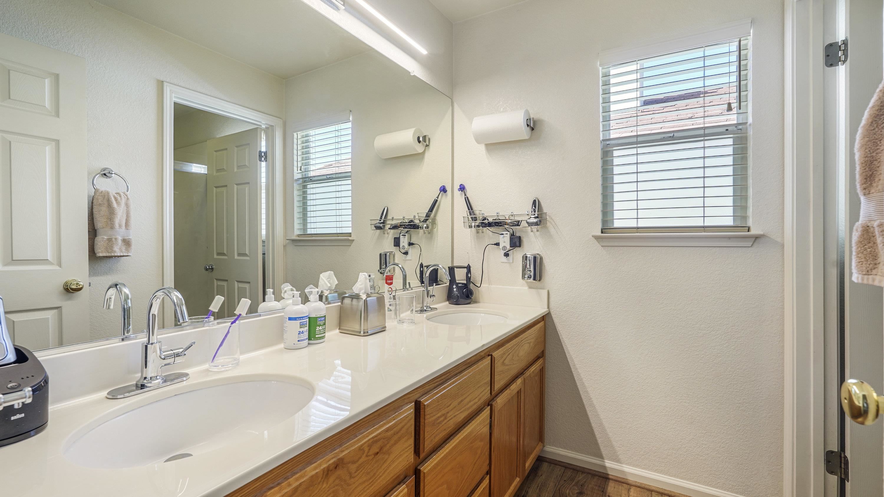 1388 Four Oaks Road San Jose, CA 95131 - Photo 38 of 47 a bathroom with a sink and a mirror