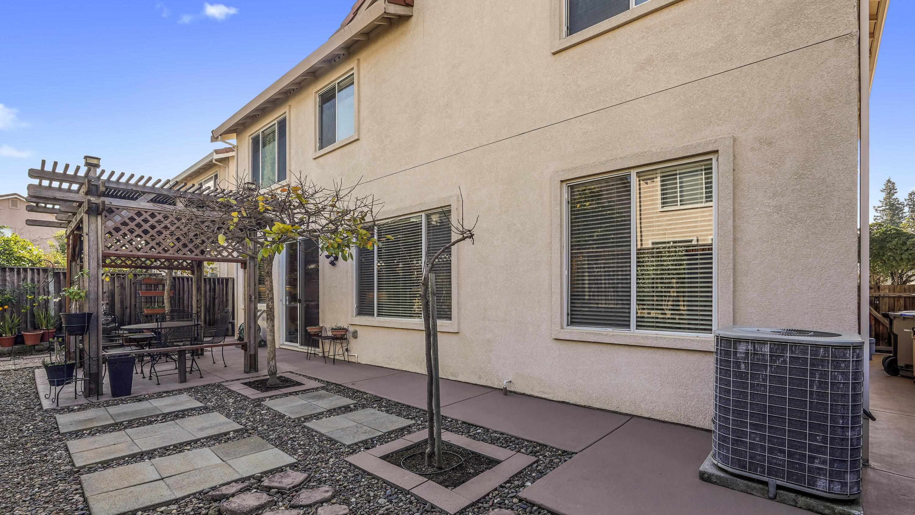 1388 Four Oaks Road San Jose, CA 95131 - Photo 42 of 47 a front view of a house with a garden