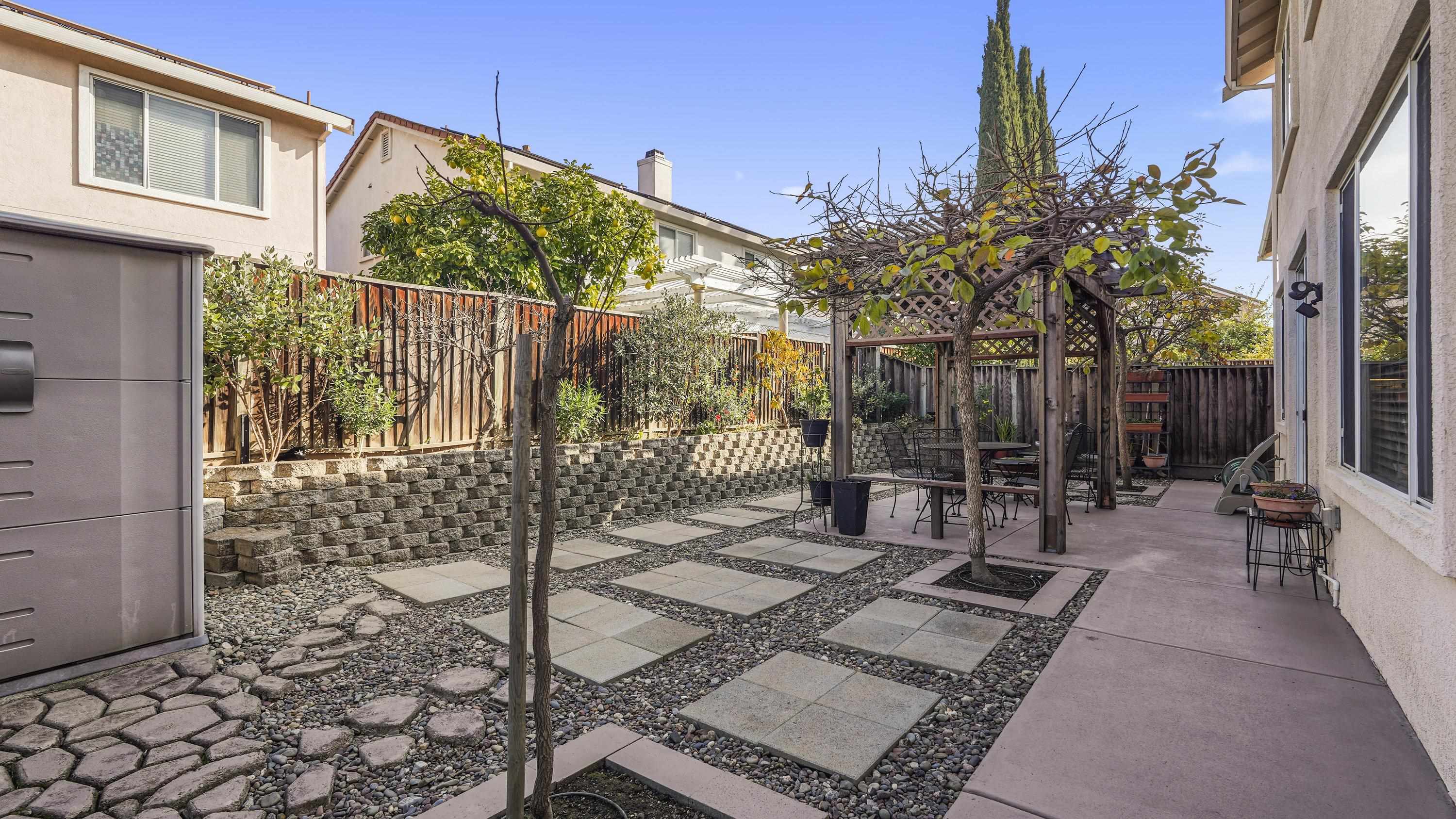 1388 Four Oaks Road San Jose, CA 95131 - Photo 44 of 47 a view of a chairs and table in backyard