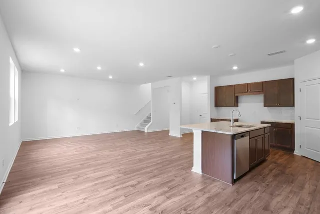 a view of kitchen with microwave and cabinets