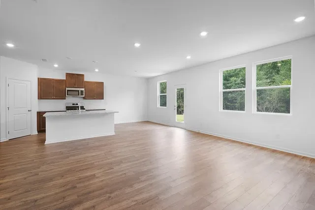 a view of kitchen with microwave and cabinets