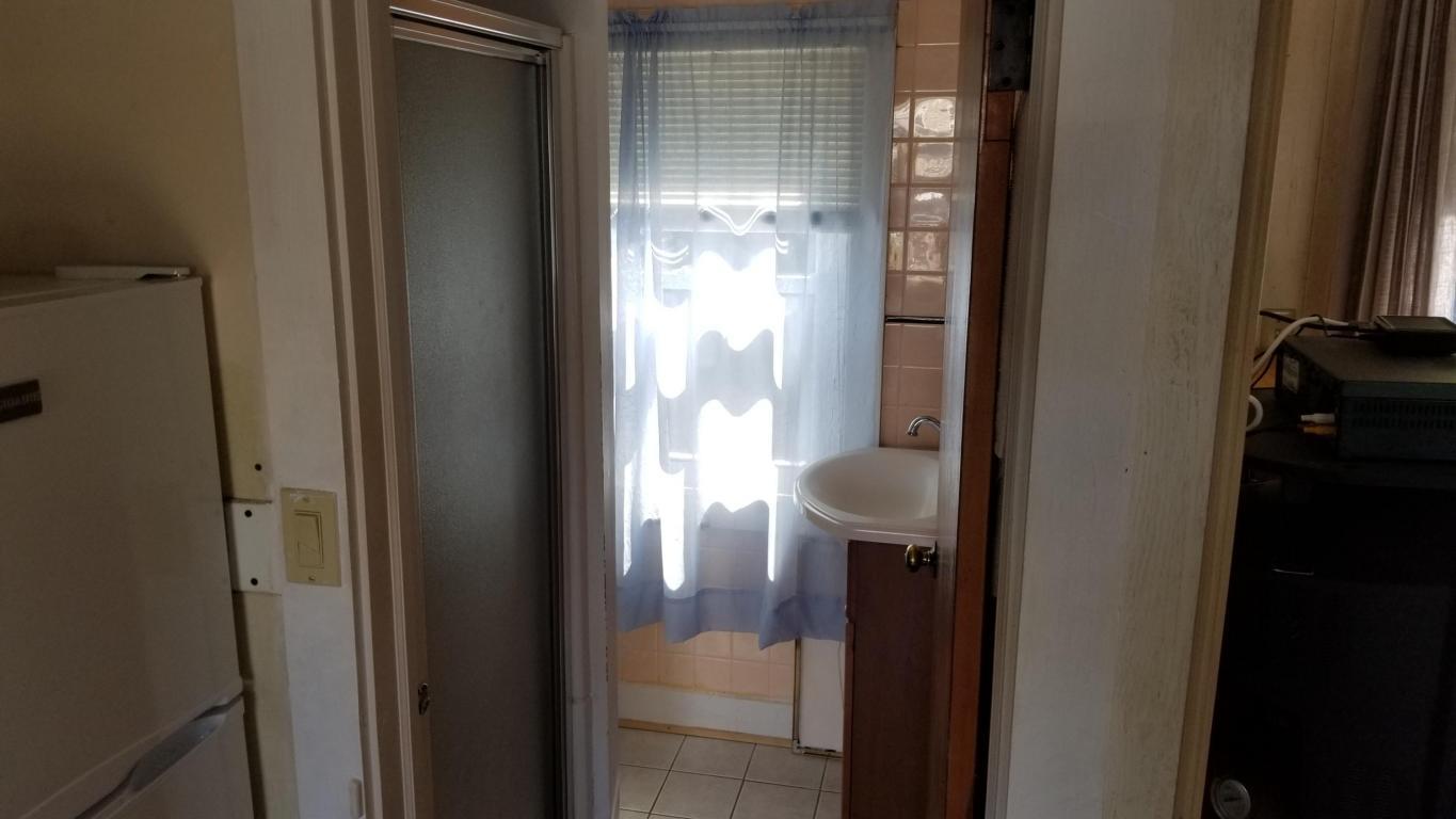 174 Captain Chase Road, Unit 17 Dennis, MA 02639 - Photo 8 of 11 a view of a bathroom from a glass door