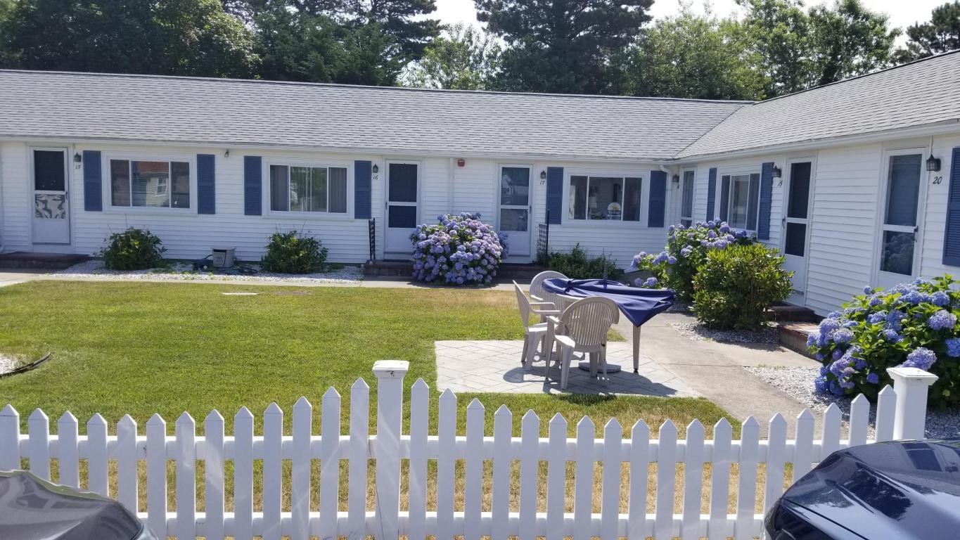 174 Captain Chase Road, Unit 17 Dennis, MA 02639 - Photo 9 of 11 a view of a house with backyard and sitting area