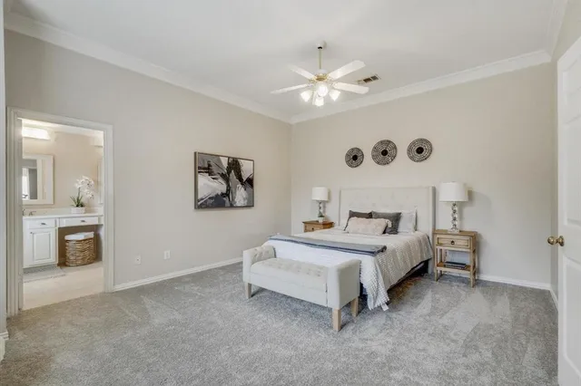 a bed room with a bed and a chandelier