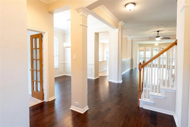 a view of an entryway with wooden floor