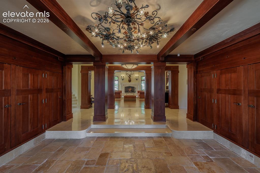 4530 Governors Point Colorado Springs, CO 80906 - Photo 8 of 49 African Mahogany entry closets and beams, doors and cabinets are detailed in Mahogany with American walnut pegging throughout the home.