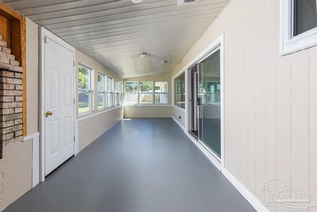 a bathroom with double vanity sinks and a mirror