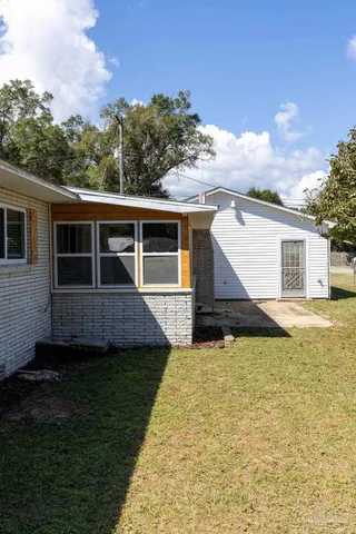 a view of a lake with houses in the background