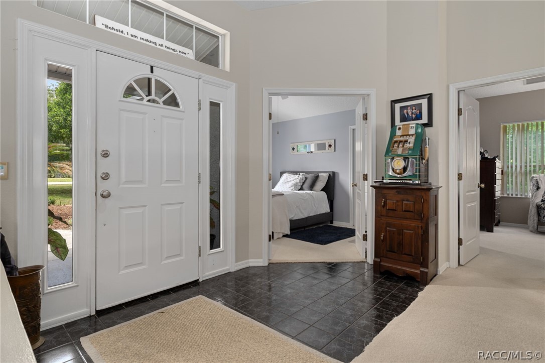 2460 West Pine Ridge Boulevard Beverly Hills, FL 34465 - Photo 15 of 47 a living room with furniture and a walk in closet