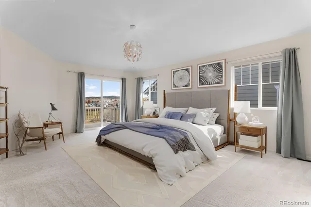 a spacious bedroom with a bed and glass window