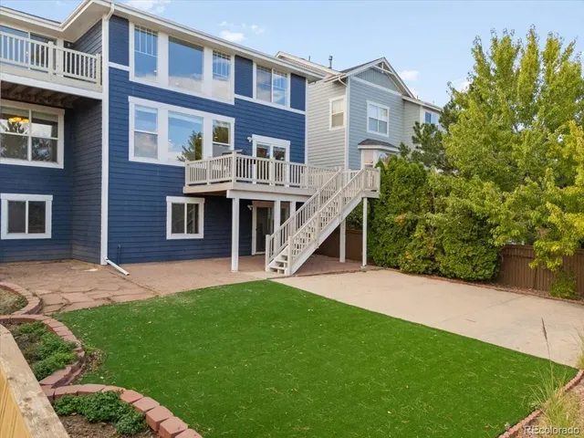 a view of a house with a yard and plants